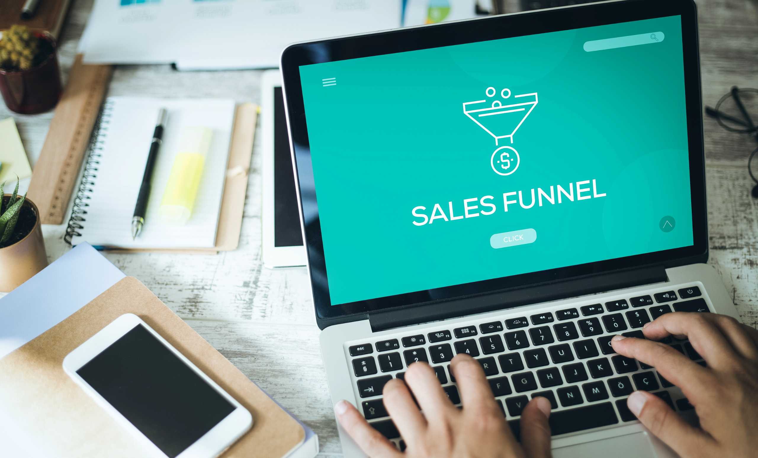 photo of a computer with a real estate sales funnel on the screen.