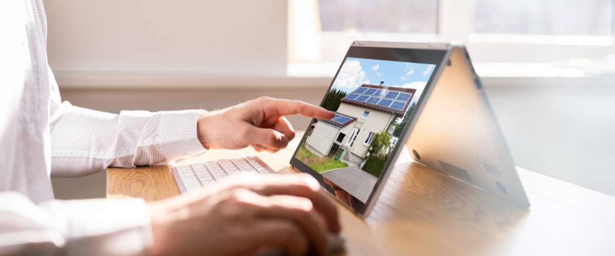 photo of realtor adding his listing on the computer