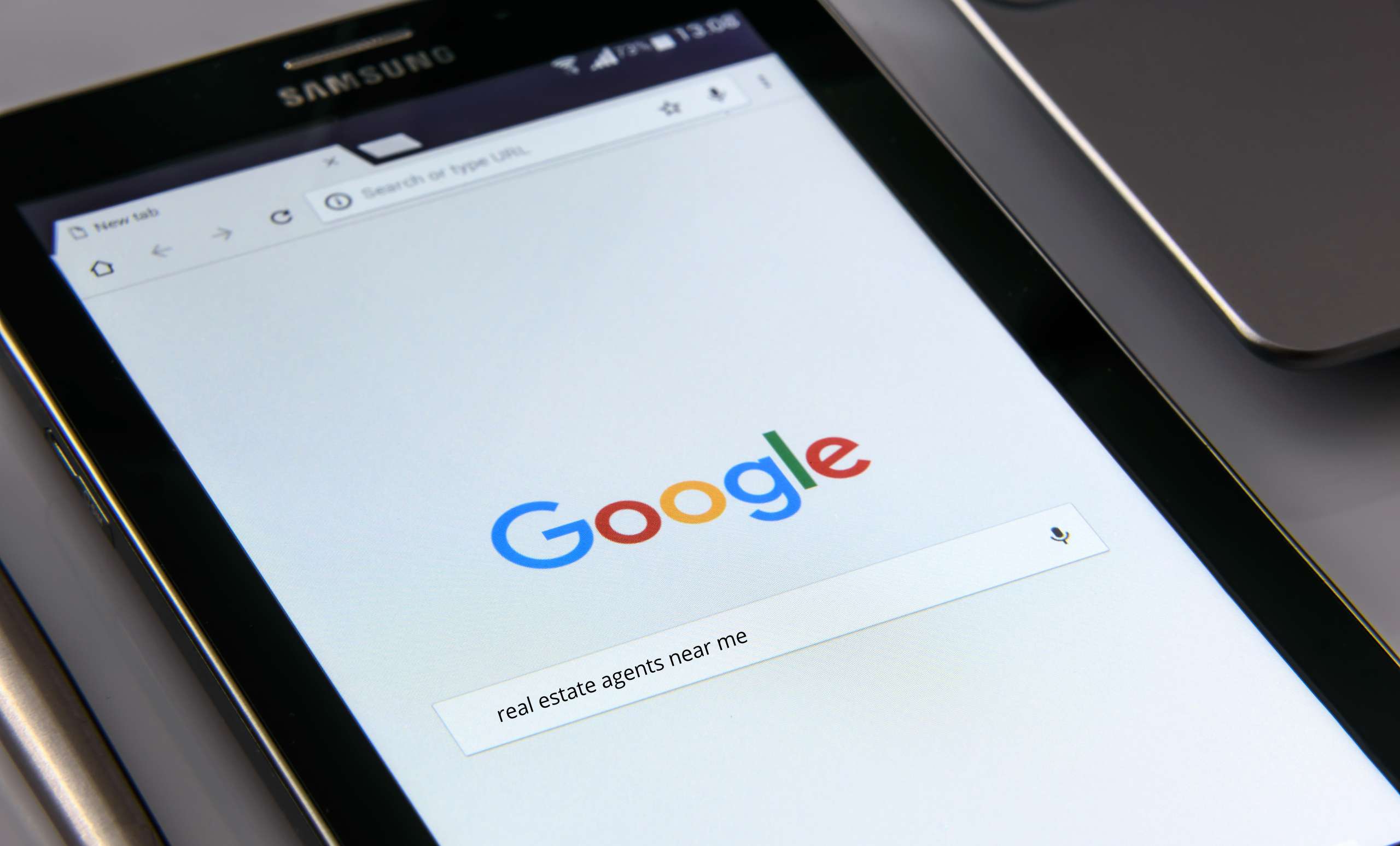photo of a tablet with Google and how a realtor can rank on Google